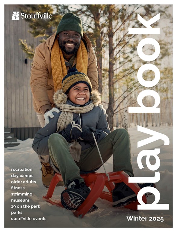 cover of winter playbook with father and son on sled